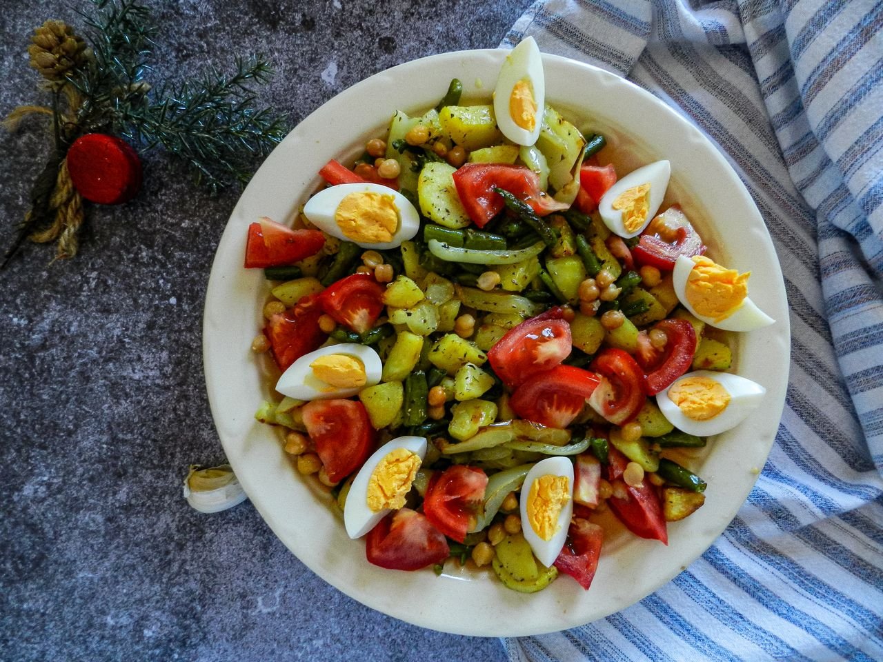 HOME Healthy vegetable salad with chickpeas, tomatoes, and eggs, perfect for a nutritious meal.